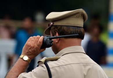 Calcutta, India - August 15, 2014 Indian police with walkie talkie.