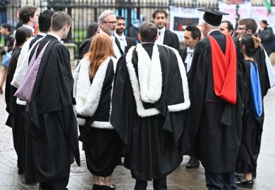 Cambridge, England, 30_November_2024, UK. Students gather on Kings Parade after attending graduation day at St Marys church along Kings Parade in Cambridge,