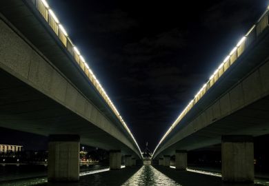 Canberra, Australia - Sep 8, 2018 Night view of the Commonwealth Avenue bridges from underneath. Parliament House in the distance. Canberra, Australia - Sep 8, 2018 Night view of the Commonwealth Avenue bridges from underneath. Parliament House in the distance.