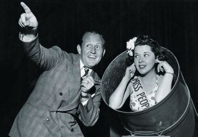 A woman about to be fired out of a cannon A woman about to be fired out of a cannon