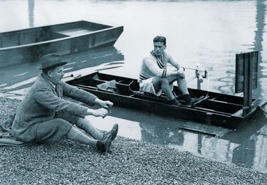 Canoeist being taught rowing seating position