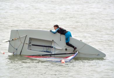 Capsized Sailing Dinghy