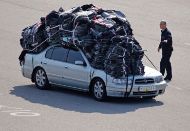 Car covered in heavy baggage