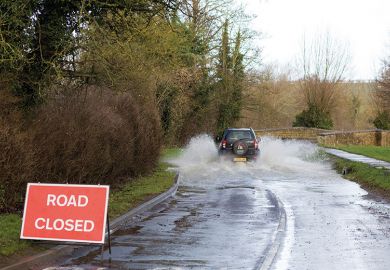 Car driving on flooded road