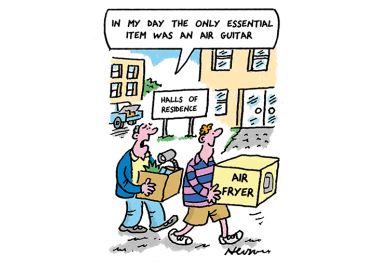 Student carrying an air fryer with father carrying more stuff