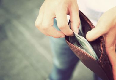 Someone takes money out of a wallet