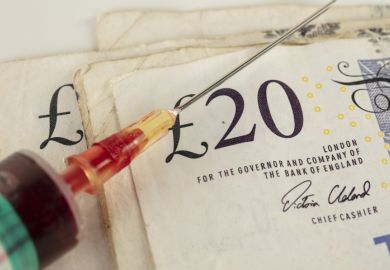 a syringe with a £20 note