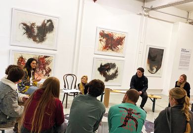 Mexican artist Chantal Meza speaking at student workshop