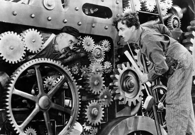 Charlie Chaplin and another actor in a scene from the movie "Modern Times." Movie released in 1936. To illustrate how automated university systems ‘make administrative burden worse’