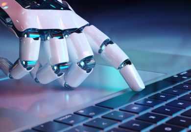 A robot hand presses a computer space bar A robot hand presses a computer space bar, symbolising ChatGPT