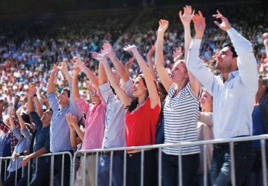Cheering crowd in stadium Cheering crowd in stadium