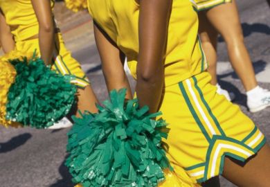 Cheerleaders marching in a parade in New Orleans, United States of America.