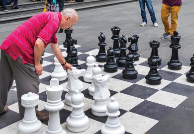 Man playing outdoor chess