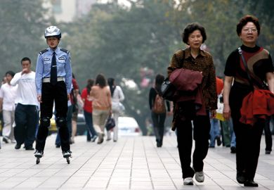 Chinese police officer on rollerblades Chinese police officer on rollerblades