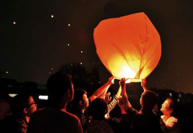 Chinese students releasing paper lanterns Chinese students releasing paper lanterns