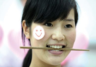 Woman with chopstick in her mouth Woman with chopstick in her mouth