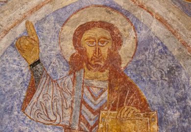 Christ pantoctator lifting his hand with a copper bracelet, in a blessing gesture, Övraby, Sweden, November 6, 2009