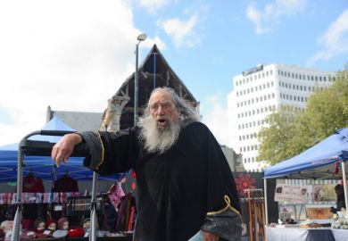 Christchurch, New Zealand, October 12, 2019 The wizard of Christchurch speaks in Cathedral Square to a crowd of tourists and spectators.