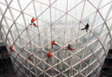 Workers clean the exterior of the Sun Valley pavilion in Shanghai, China Workers clean the exterior of the Sun Valley pavilion in Shanghai, China