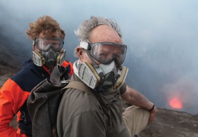 Clive Oppenheimer and Wwerner Herzog standing beside volcano