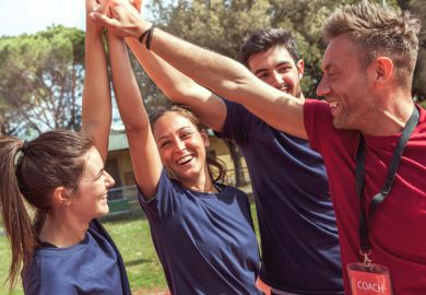 Three athletes with coach