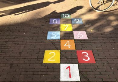 Colourful tiles in an Amsterdam sidewalk for playing hopscotch