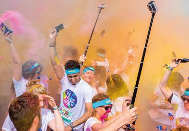 Birmingham Color run 2016. Young people with selfie sticks