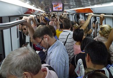 Commuters packed into overcrowded subway train Commuters packed into overcrowded subway train
