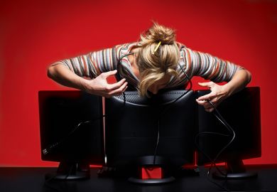 Woman leaning over computer Woman leaning over computer