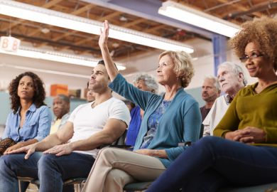An audience member asks a question at a conference