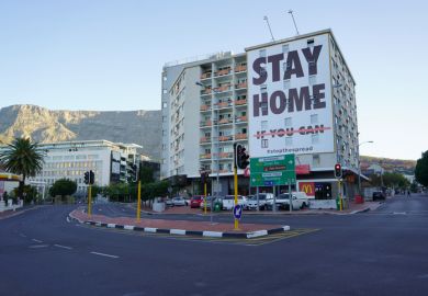 a building with a coronavirus lockdown sign in Cape Town