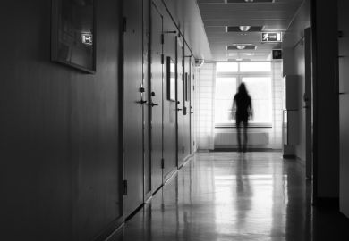 A woman leaving a corridor