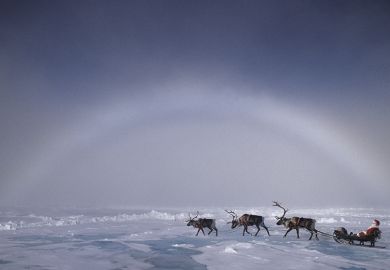 Santa pulled by reindeer under an ice bow, ice crystals creating the arctic equivalent of a rainbow Santa pulled by reindeer under an ice bow, ice crystals creating the arctic equivalent of a rainbow