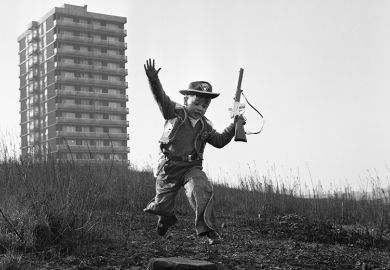Young boy playing cowboys in Collyhurst, Manchester 14th January 1968