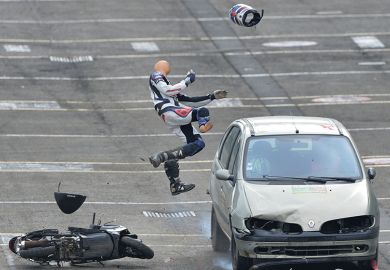 Car hits human dummy on scooter