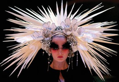 Female model wearing elaborate headdress