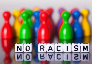 Cube letters show the words No Racism Cube letters show the words No Racism