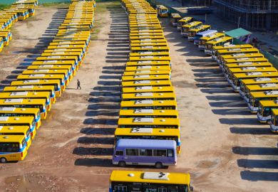 Da Nang, Vietnam - Feb 11, 2020 Aerial view of local buses at a spacious parking zone under Thuan Phuoc bridge during Tet - Vietnamese lunar new year.