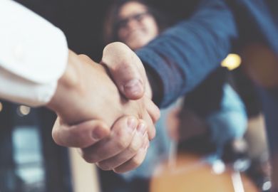 Hands shaking to make a deal