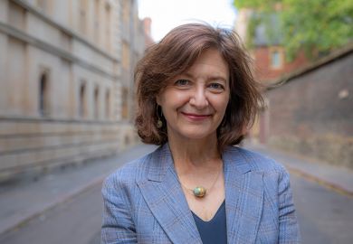 Vice-chancellor Professor Deborah Prentice standing on Trinity Lane near the Old Schools, University of Cambridge.