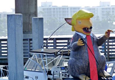 December 29, 2018, Lake Worth, Florida, USA. An inflatable balloon resembling President Trump is located on a boat who opposes the President.