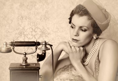 Woman waiting for phone to ring Woman waiting for phone to ring