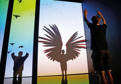 Boy facing a silhouette of a winged man