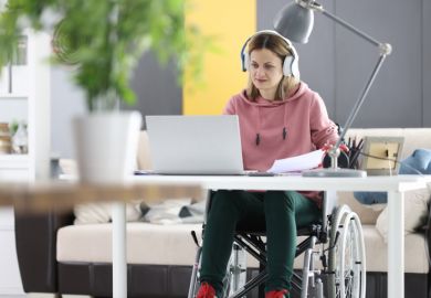 A disabled student working at home