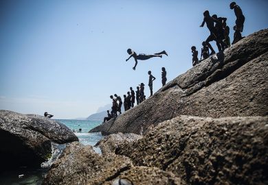 Boy diving into ocean