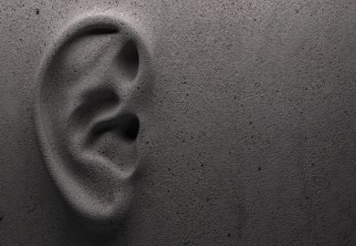 A ear on a wall, symbolising the difficulty of communication