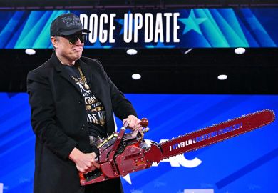 Elon Musk, head of DOGE, holds a chainsaw during the annual Conservative Political Action Conference (CPAC) at the Gaylord National Resort & Convention Center at National Harbor in Oxon Hill, Maryland, on 20 February 2025