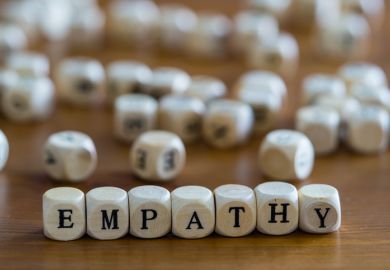 Dice spell out the word "empathy" Dice spell out the word "empathy"