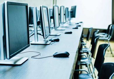 Empty computer lab illustrating online education platform edX sale to 2U