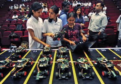 Engineering students prepare smart car race, Bangalore, 2011